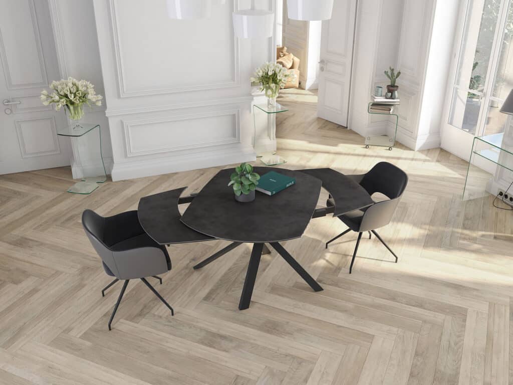 table Kheops avec plateau en céramique finition iron et piétement géométrique moderne