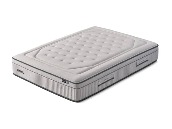 Light gray tufted mattress with a quilted top and padded sides on a white background.